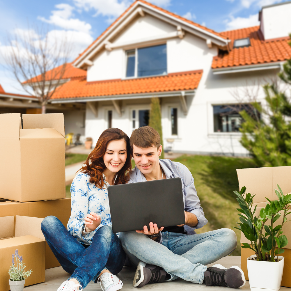 happy-couple-with-their-new-house-background-smiling